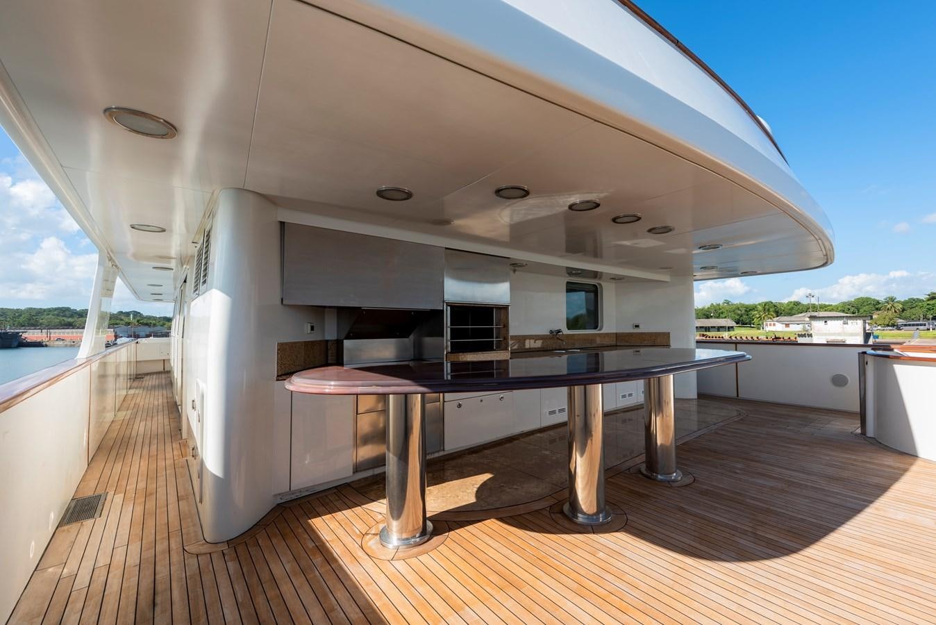a large kitchen with a table aboard BIG ARON Yacht for Sale