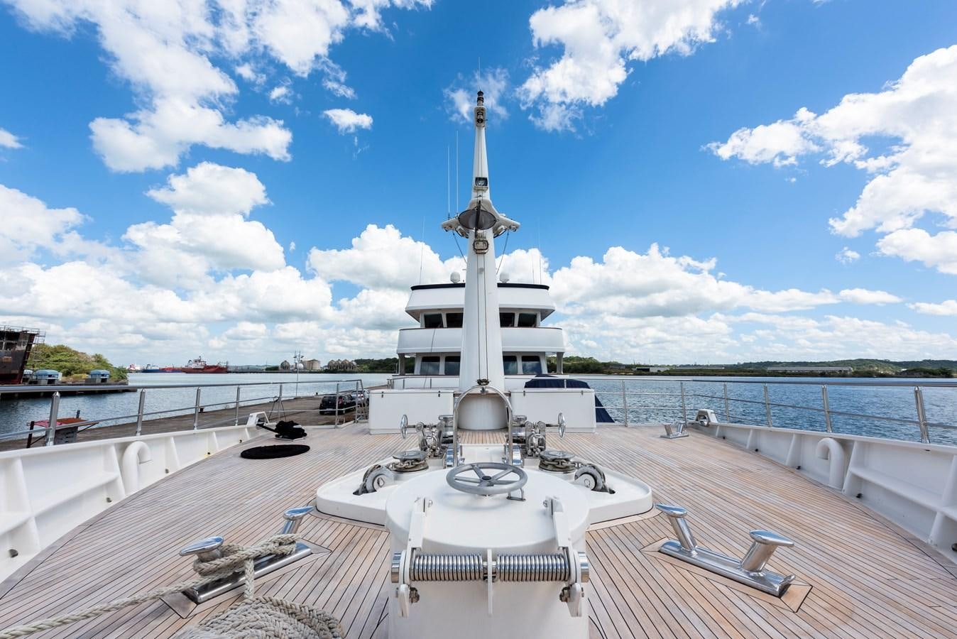 a white building with a tower aboard BIG ARON Yacht for Sale