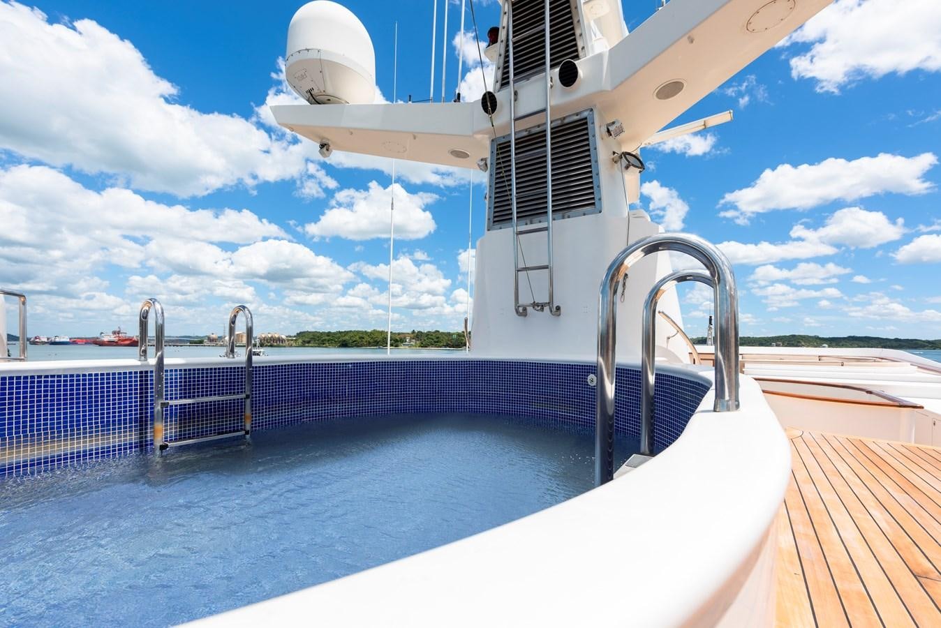 a large white boat with a metal railing and a metal railing aboard BIG ARON Yacht for Sale