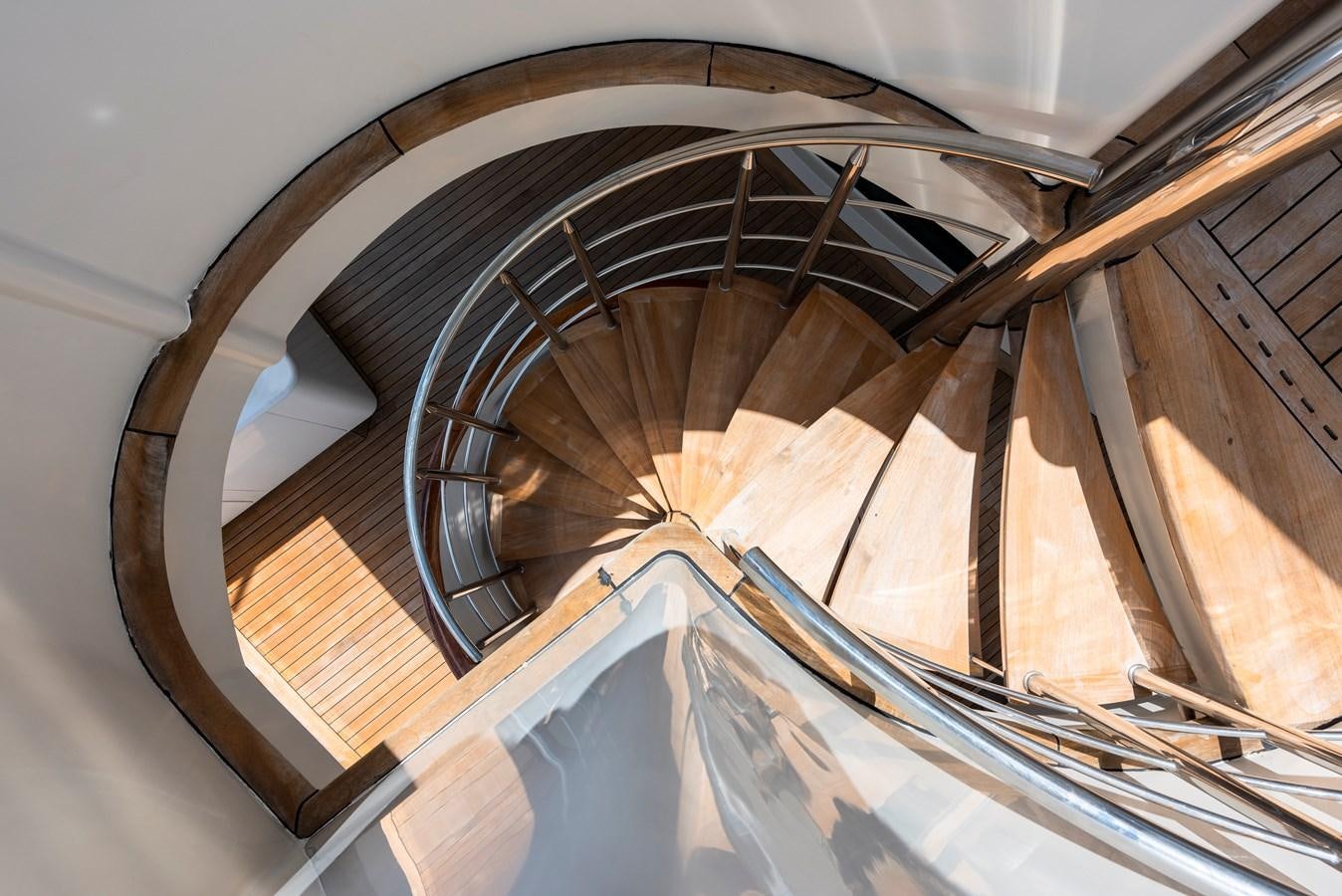 a spiral staircase with a spiral staircase aboard BIG ARON Yacht for Sale