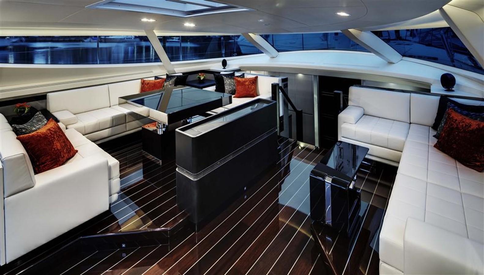 a room with a couch and a table aboard BLISS Yacht for Charter