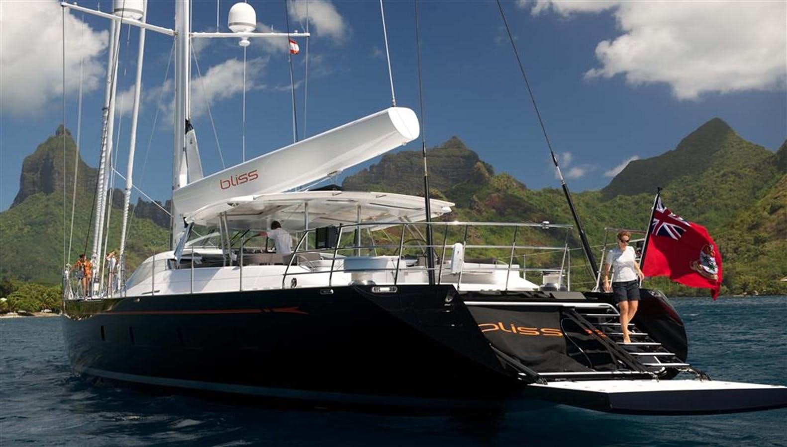 a boat with a flag on it aboard BLISS Yacht for Charter