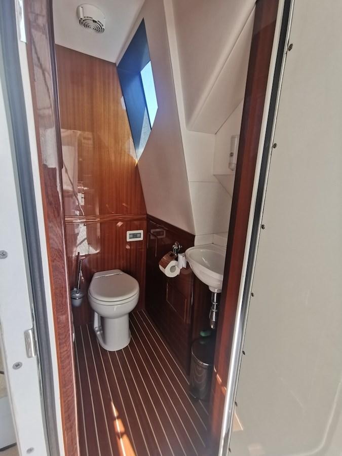 a bathroom with a toilet and sink aboard ALBINA Yacht for Sale