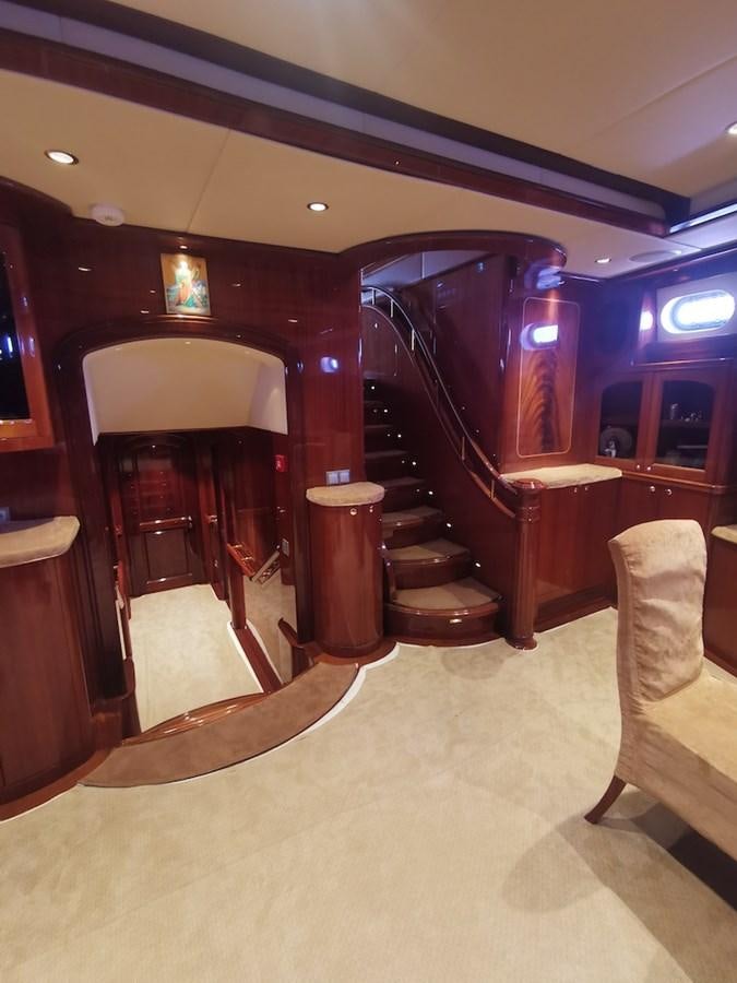 a room with a staircase and a chair aboard ALBINA Yacht for Sale