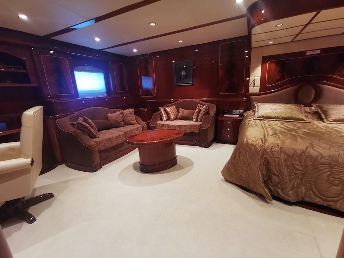 a bedroom with a bed and a couch aboard ALBINA Yacht for Sale