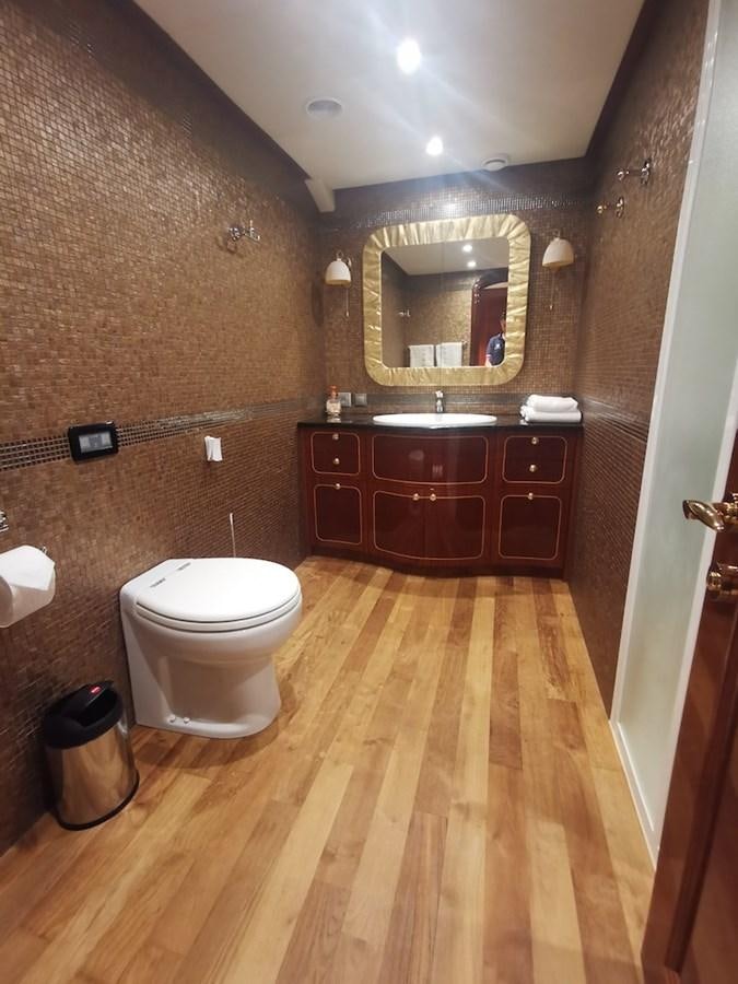 a bathroom with a toilet and a sink aboard ALBINA Yacht for Sale
