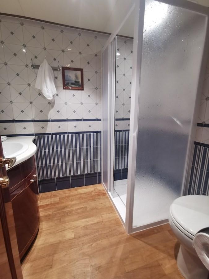 a bathroom with a glass shower aboard ALBINA Yacht for Sale