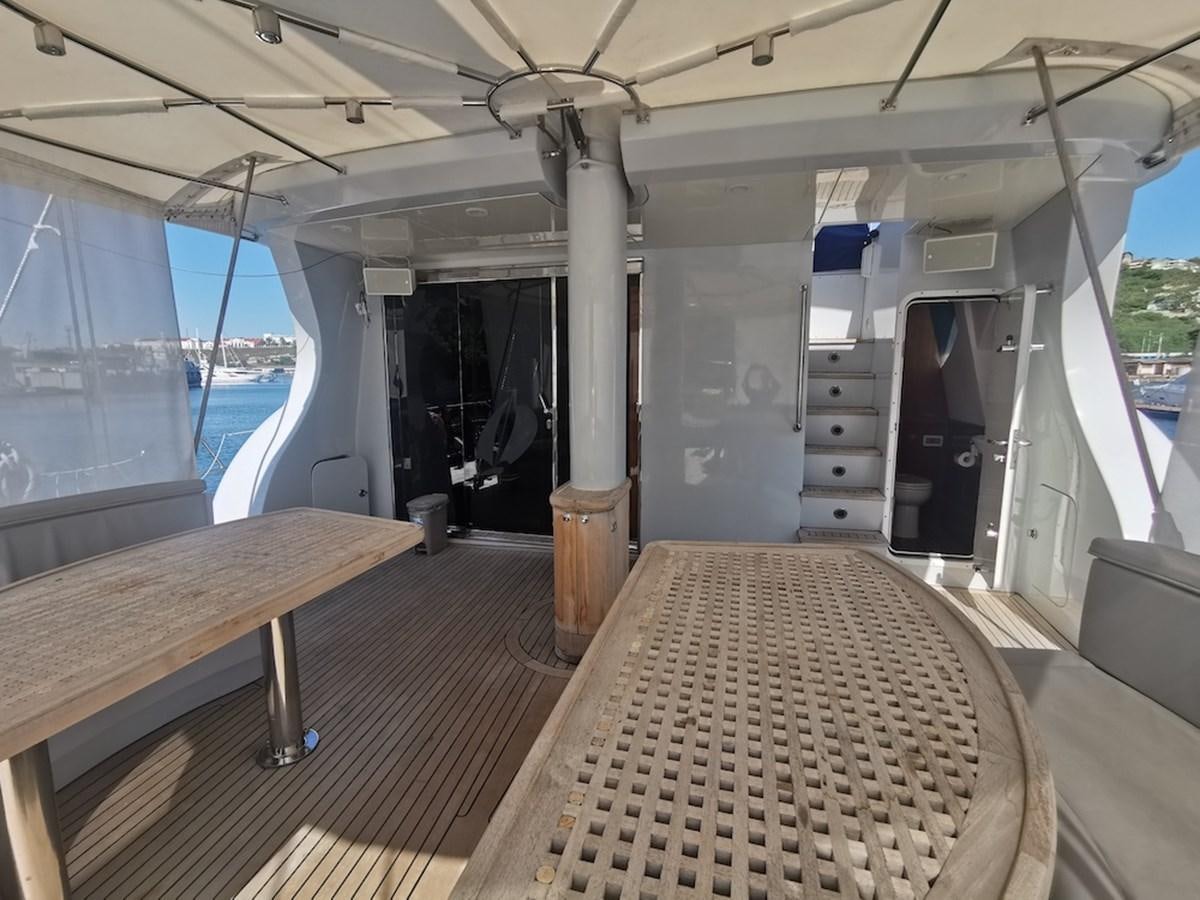 a long wooden table in a room aboard ALBINA Yacht for Sale