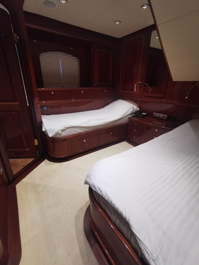 a room with a bed and a mirror aboard ALBINA Yacht for Sale