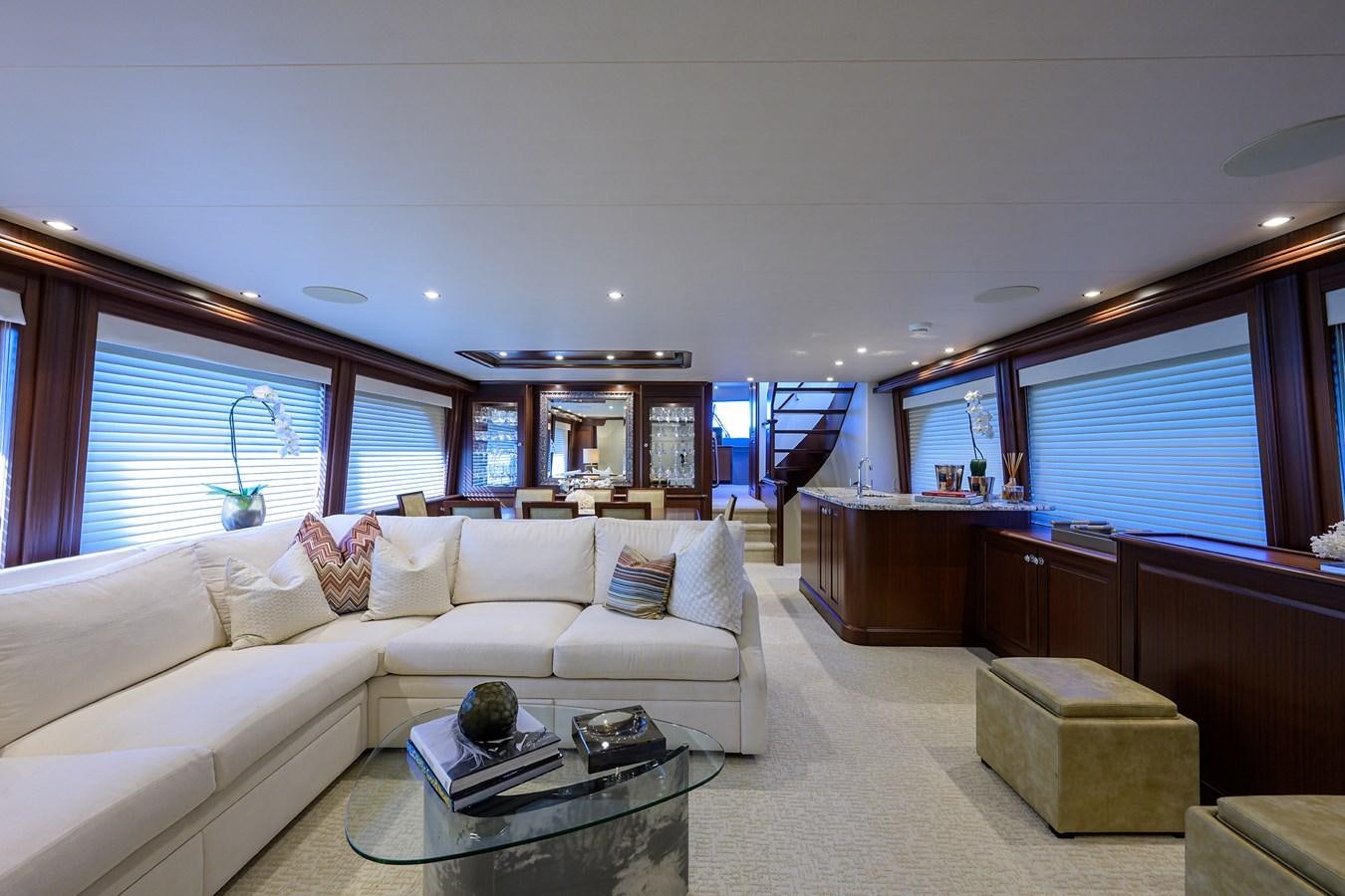 a living room with a white couch aboard ROBINSON CRUSOE Yacht for Sale