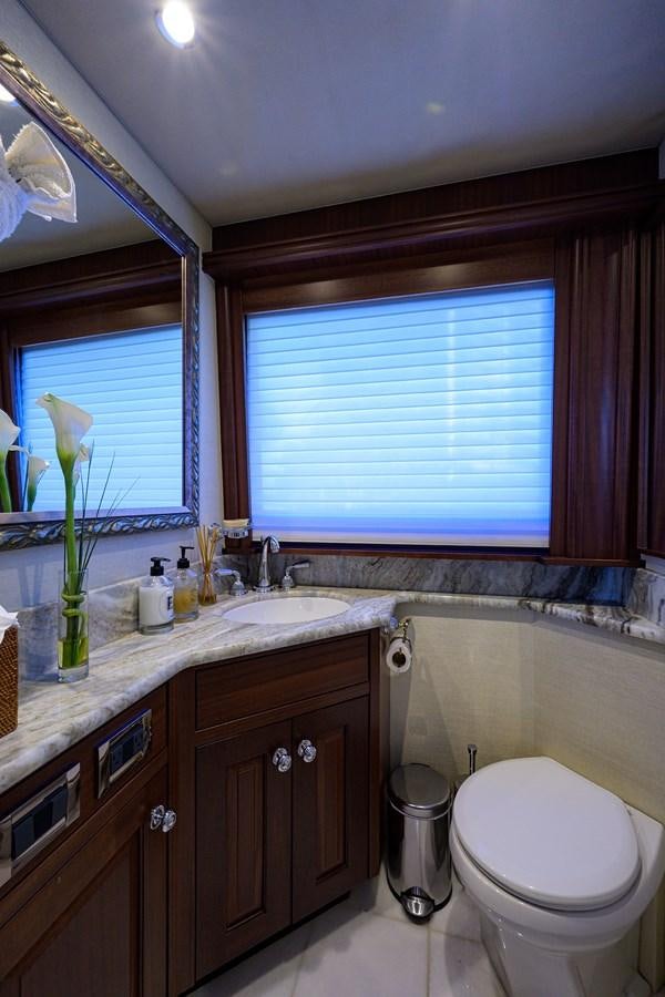 a bathroom with a toilet and a sink aboard ROBINSON CRUSOE Yacht for Sale