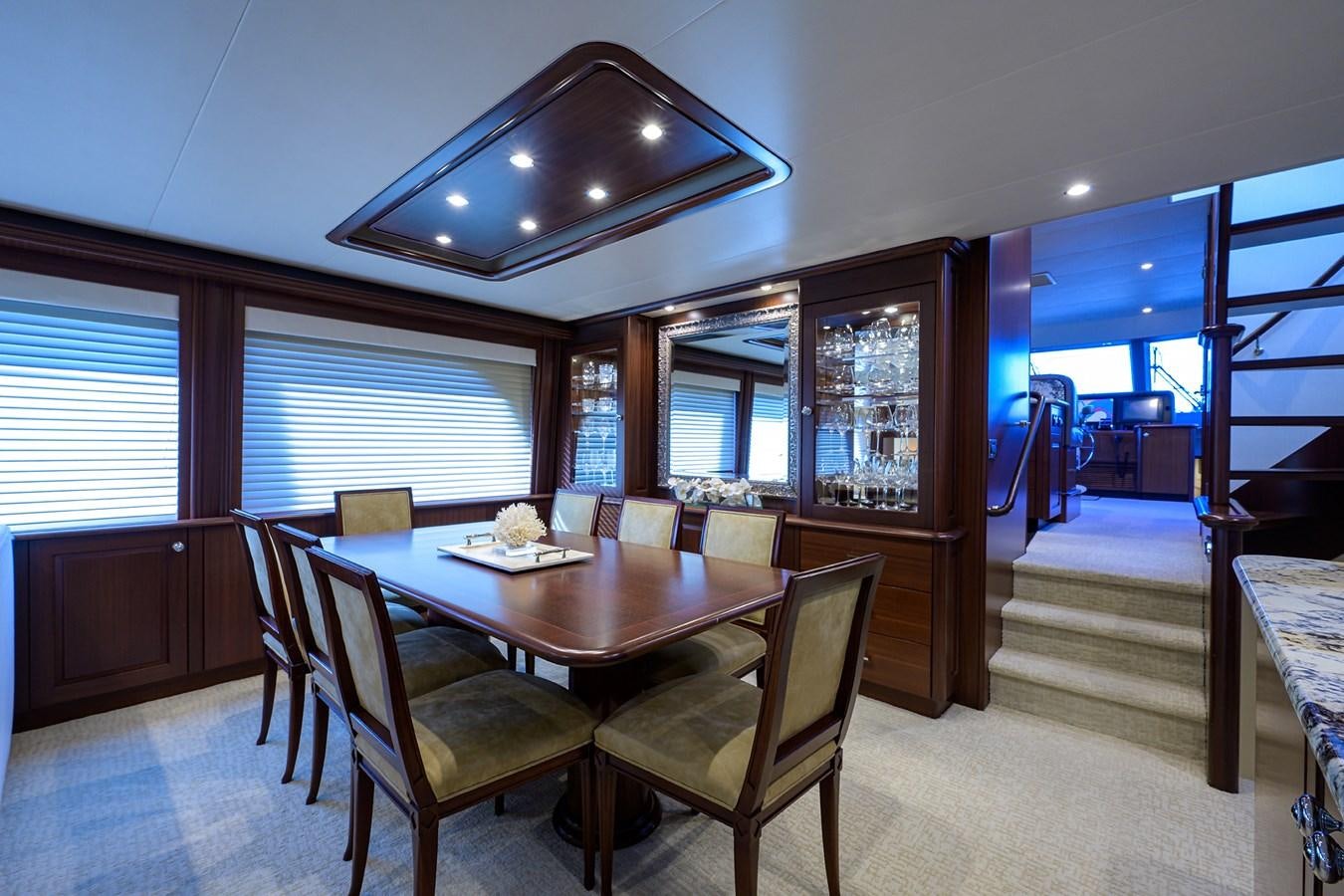 a dining room with a table and chairs aboard ROBINSON CRUSOE Yacht for Sale
