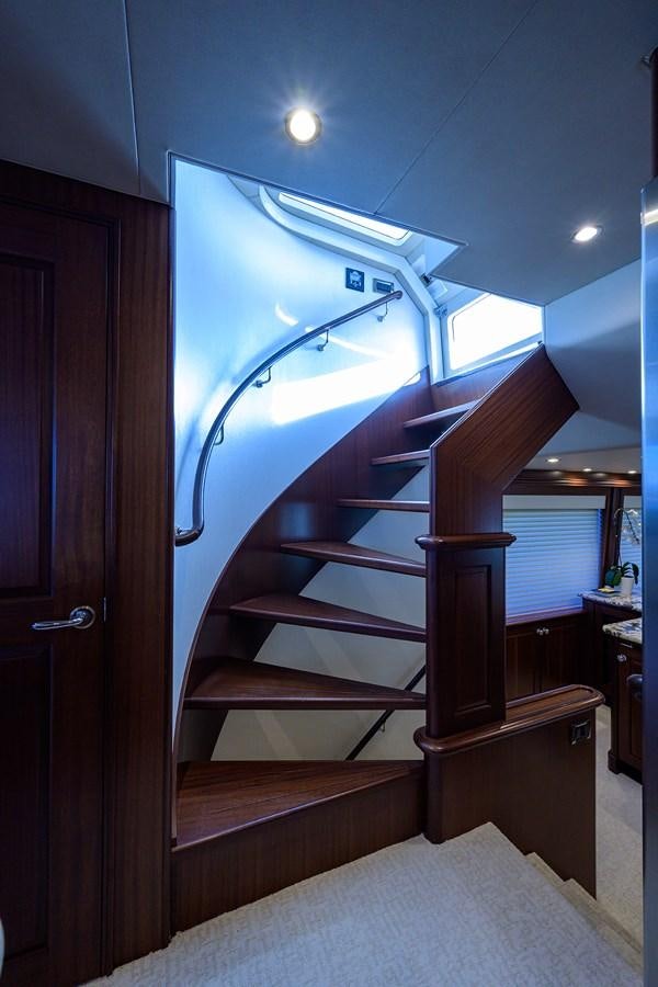 a bunk bed with a light on the ceiling aboard ROBINSON CRUSOE Yacht for Sale