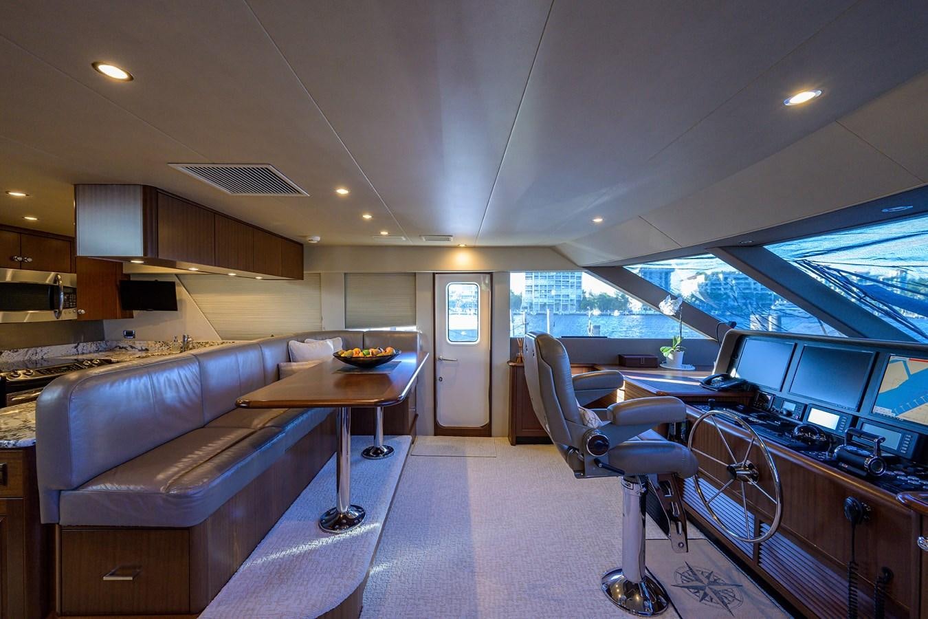 a room with a couch and a desk with a computer aboard ROBINSON CRUSOE Yacht for Sale