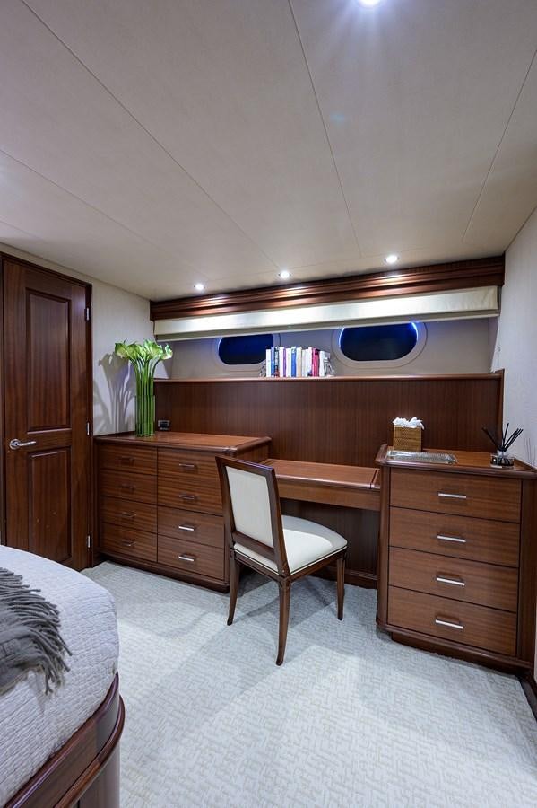 a bedroom with a desk and a chair aboard ROBINSON CRUSOE Yacht for Sale