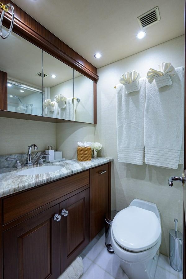 a bathroom with a toilet and a sink aboard ROBINSON CRUSOE Yacht for Sale