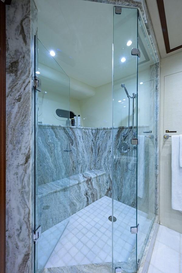 a bathroom with a glass shower aboard ROBINSON CRUSOE Yacht for Sale