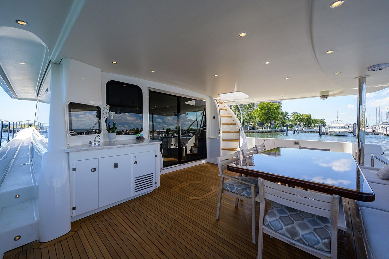 a large room with a pool table and chairs aboard ROBINSON CRUSOE Yacht for Sale