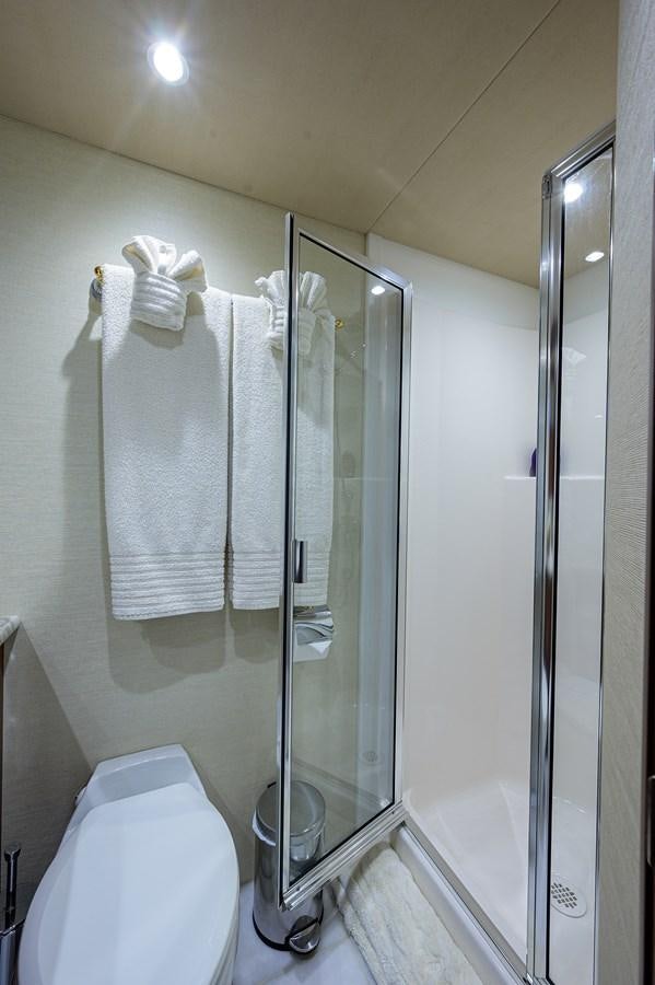 a bathroom with a glass shower aboard ROBINSON CRUSOE Yacht for Sale