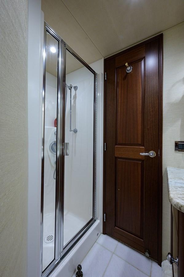 a bathroom with a glass shower door aboard ROBINSON CRUSOE Yacht for Sale