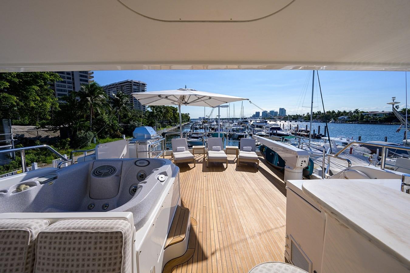 a deck with a deck and a view of a city aboard ROBINSON CRUSOE Yacht for Sale