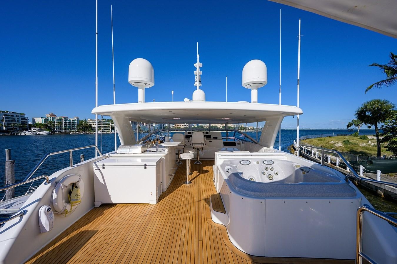 a large white boat on a deck aboard ROBINSON CRUSOE Yacht for Sale