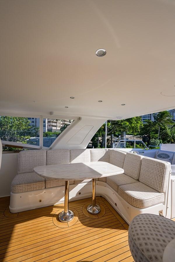 a room with a table and chairs aboard ROBINSON CRUSOE Yacht for Sale