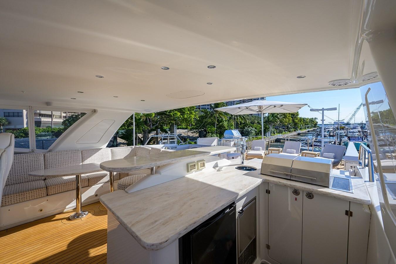 a room with tables and chairs aboard ROBINSON CRUSOE Yacht for Sale