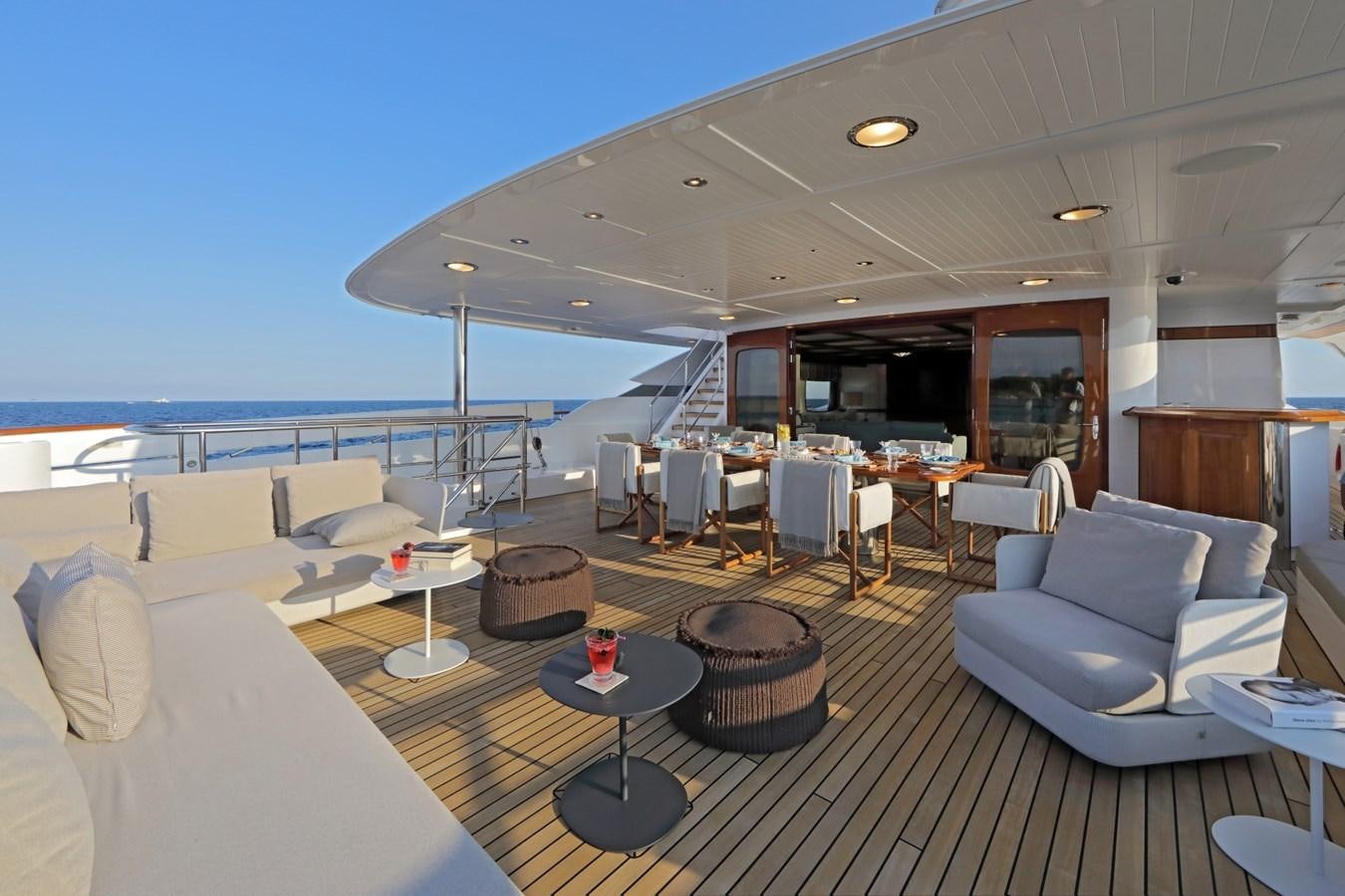 a large living room with a large balcony aboard AWATEA Yacht for Sale