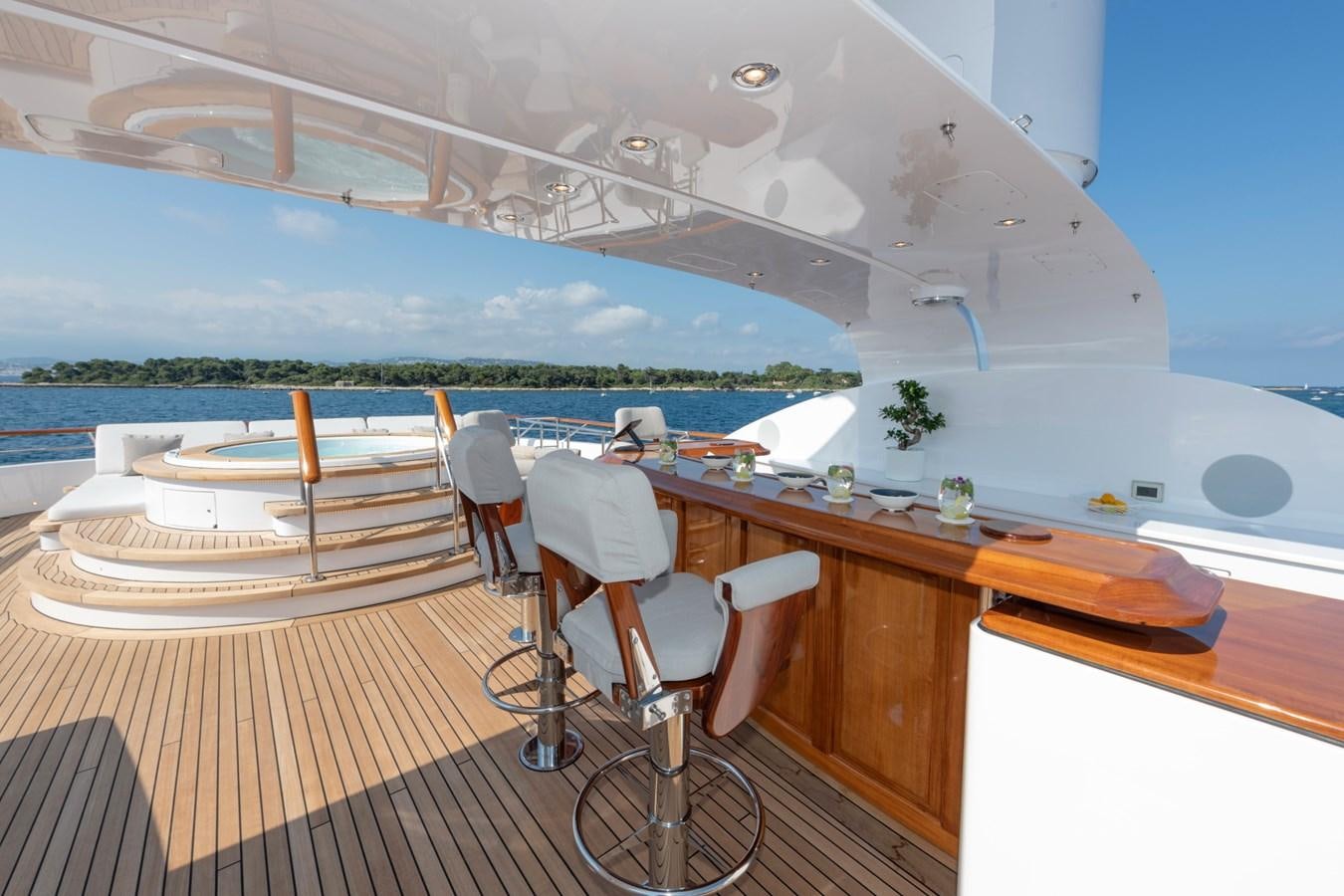 a room with a table and chairs aboard AWATEA Yacht for Sale