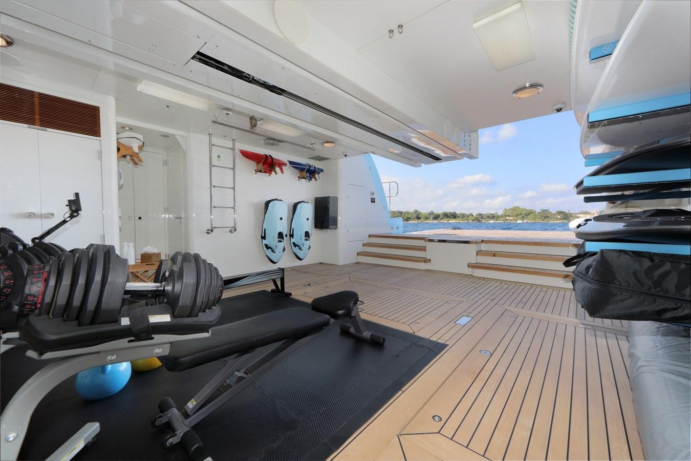a room with a large bed and a large black mat on the floor aboard AWATEA Yacht for Sale