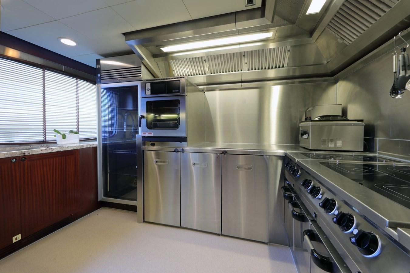 a kitchen with stainless steel appliances aboard AWATEA Yacht for Sale