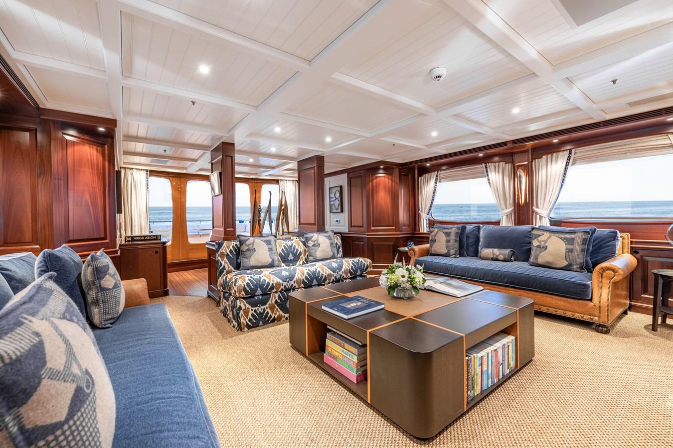 a living room with a couch and a coffee table aboard AWATEA Yacht for Sale