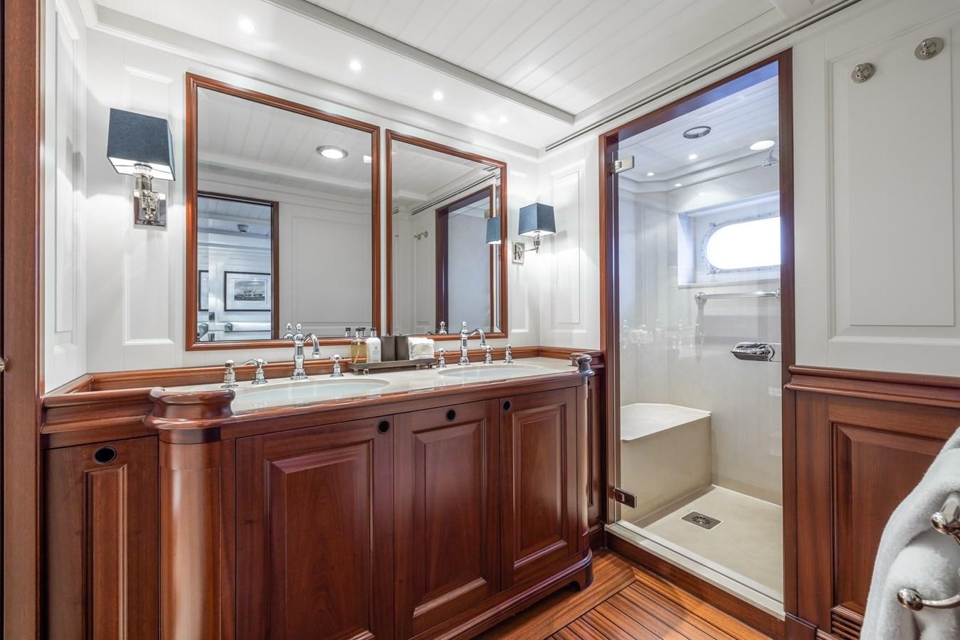a bathroom with a large mirror aboard AWATEA Yacht for Sale