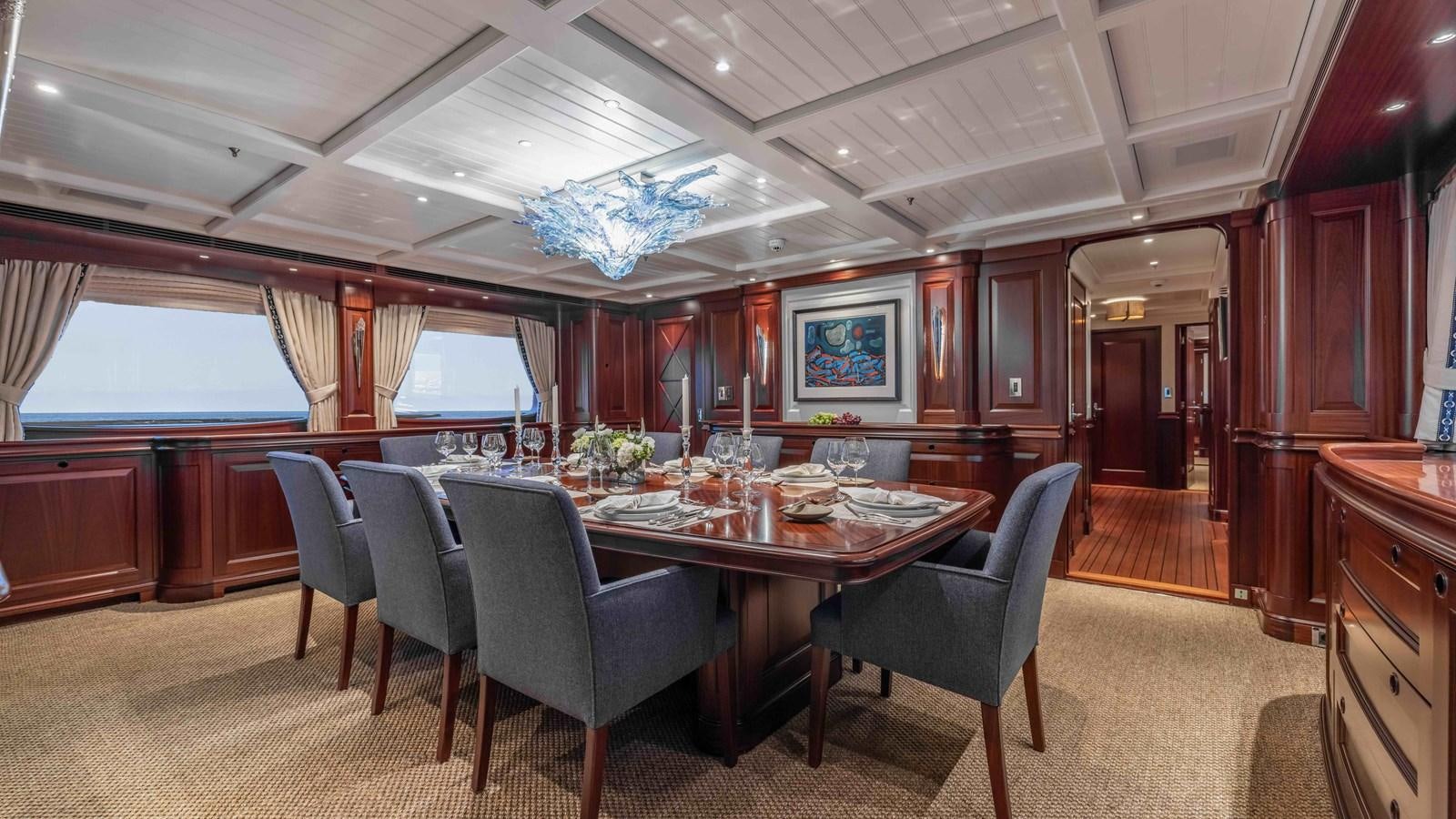 a large dining room with a table and chairs aboard AWATEA Yacht for Sale