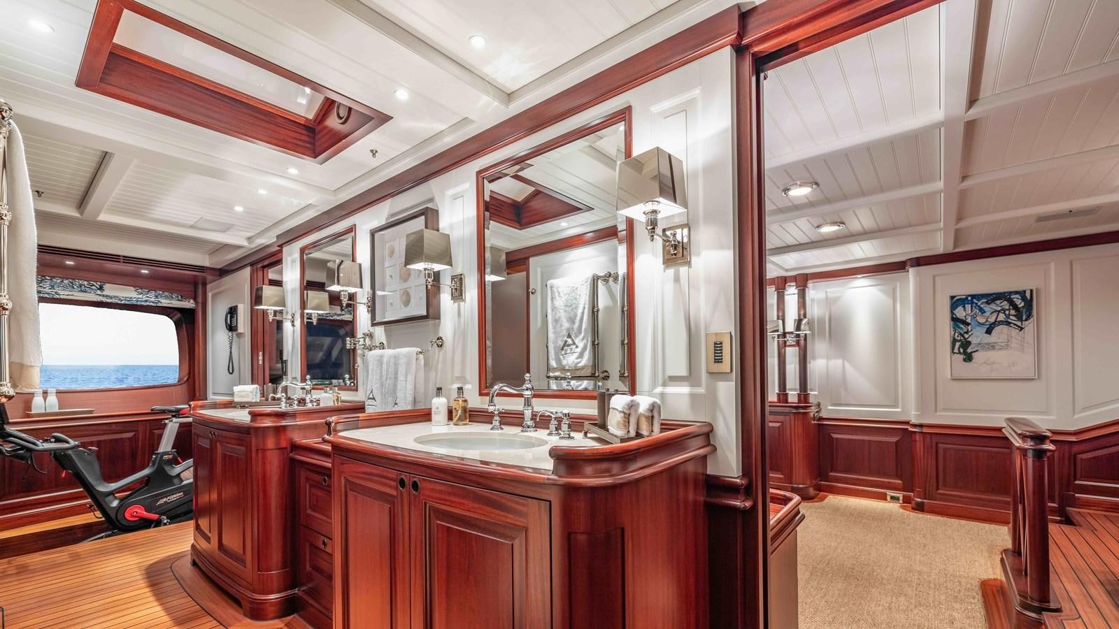 a bathroom with a sink and a mirror aboard AWATEA Yacht for Sale