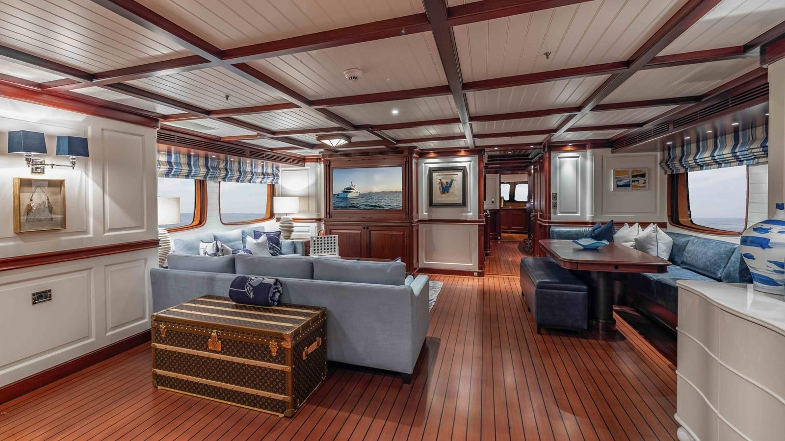 a living room with a large open ceiling aboard AWATEA Yacht for Sale