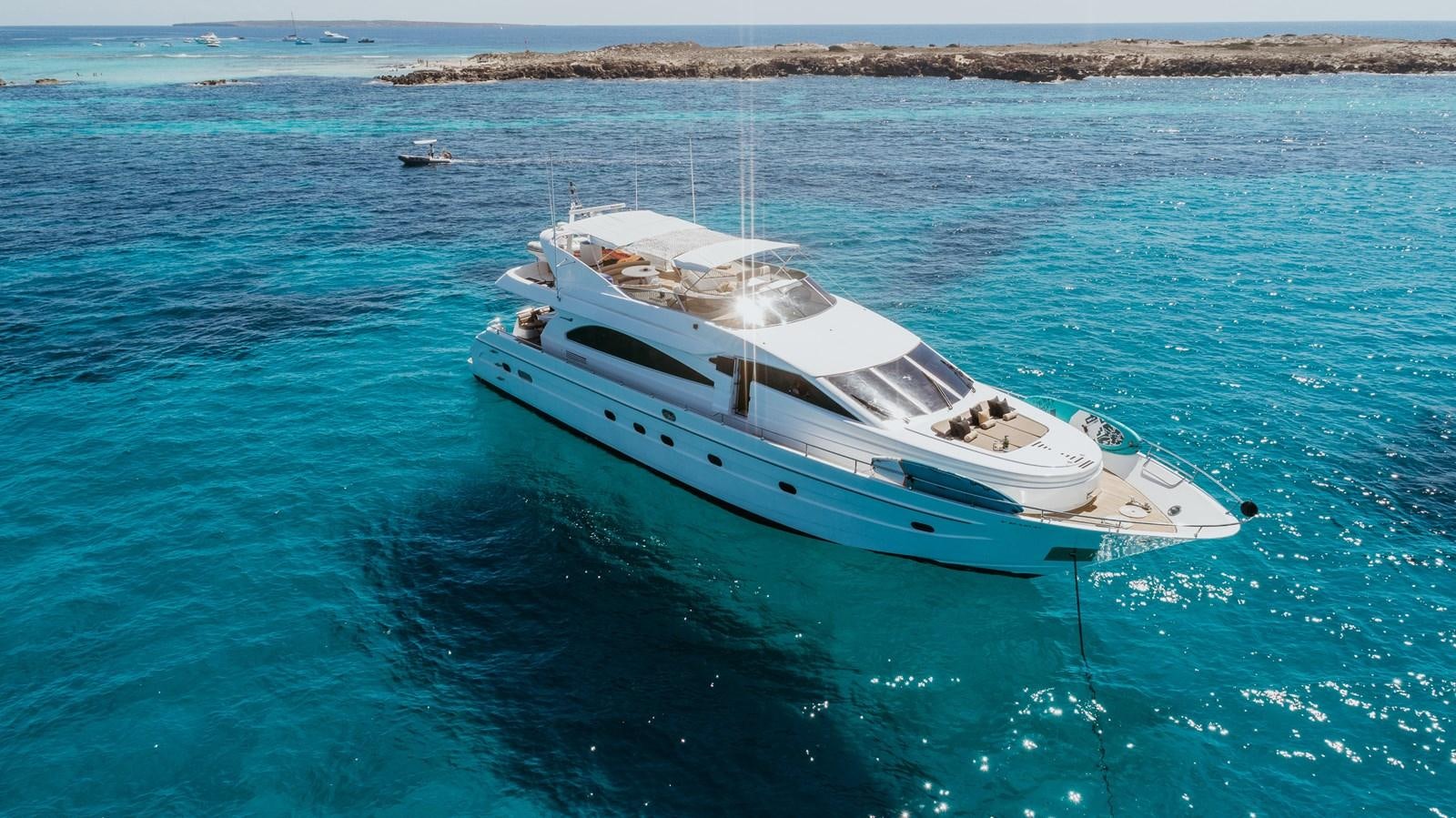 a white boat in the water aboard NEPHENTA Yacht for Sale