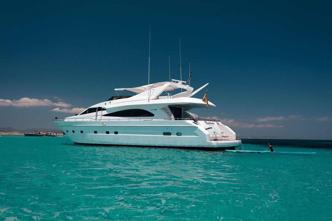 a white boat in the water aboard NEPHENTA Yacht for Sale