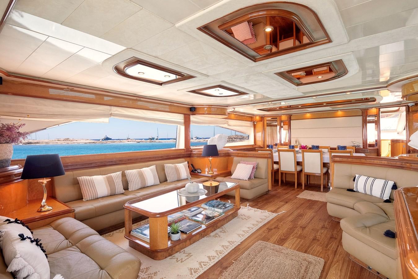 a living room with a large open floor plan aboard NEPHENTA Yacht for Sale