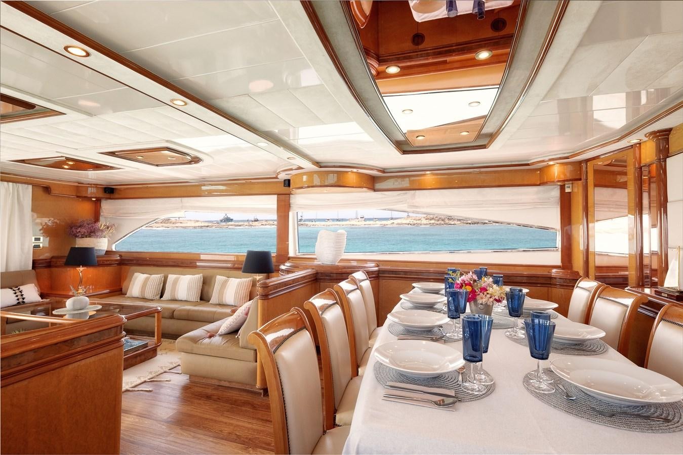 a room with a table and chairs aboard NEPHENTA Yacht for Sale