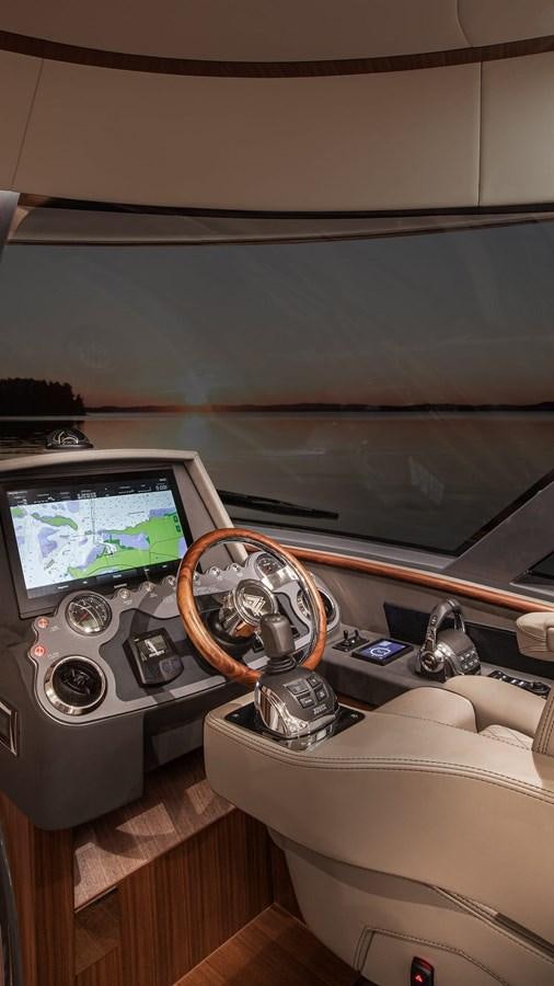 a car with a steering wheel aboard BELIZE 66 DAYBRIDGE Yacht for Sale