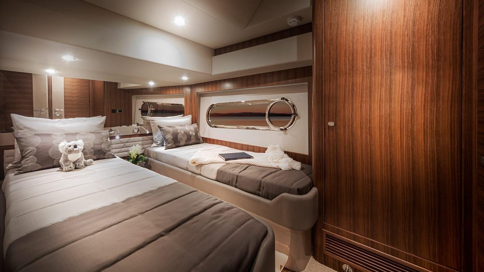 a bed with a mirror above it aboard BELIZE 66 DAYBRIDGE Yacht for Sale
