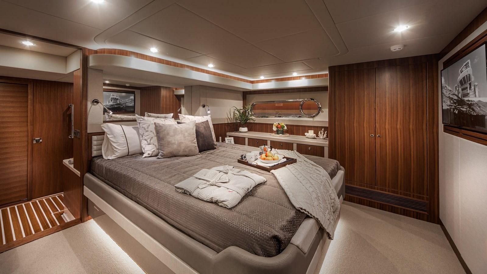 a bed in a room aboard BELIZE 66 DAYBRIDGE Yacht for Sale