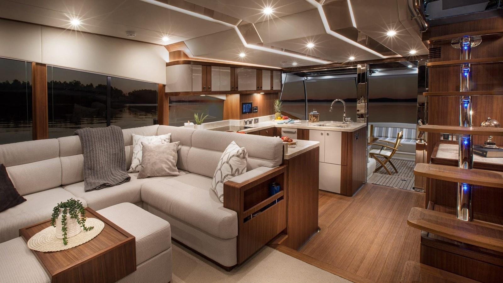 a living room with a couch and a table aboard BELIZE 66 DAYBRIDGE Yacht for Sale
