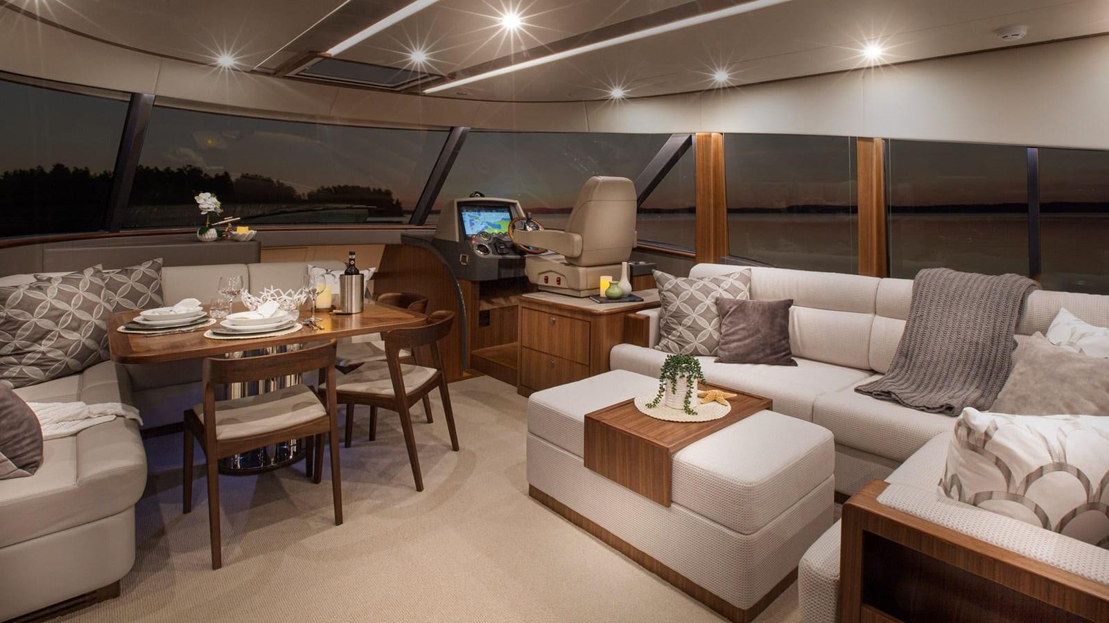 a living room with a couch and a table aboard BELIZE 66 DAYBRIDGE Yacht for Sale