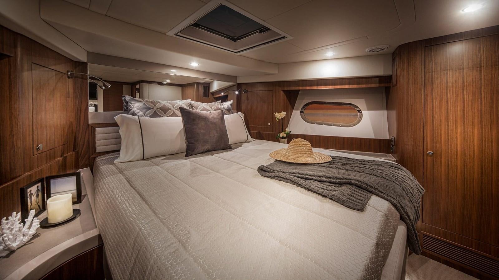 a bed in a cabin aboard BELIZE 66 DAYBRIDGE Yacht for Sale