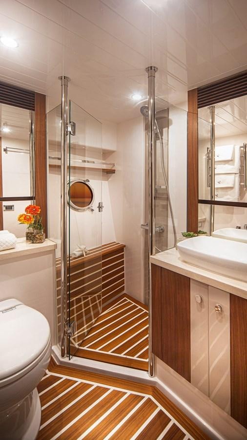 a bathroom with a shower unit and sink aboard BELIZE 66 DAYBRIDGE Yacht for Sale