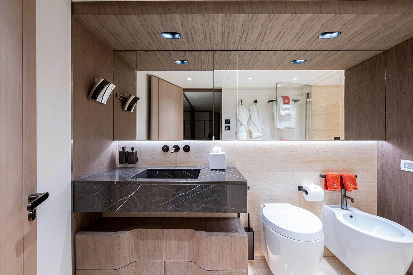 a bathroom with a large mirror aboard CHECKED OUT Yacht for Sale