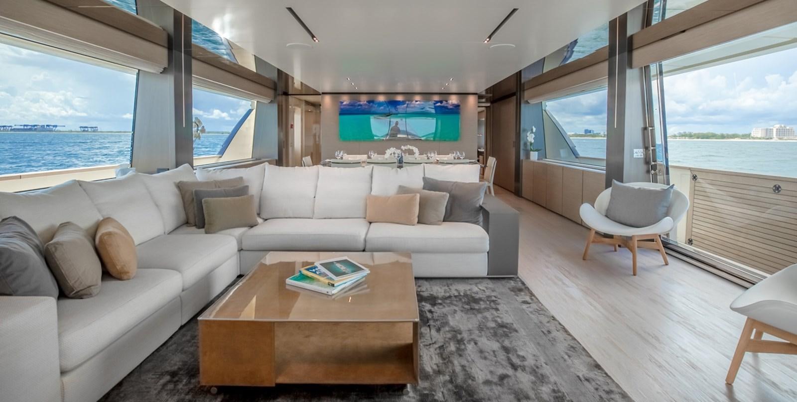 a living room with a large window aboard OCEAN Z Yacht for Sale
